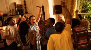 Boxing Day, courtesy of Warner Bros. A group of people dancing