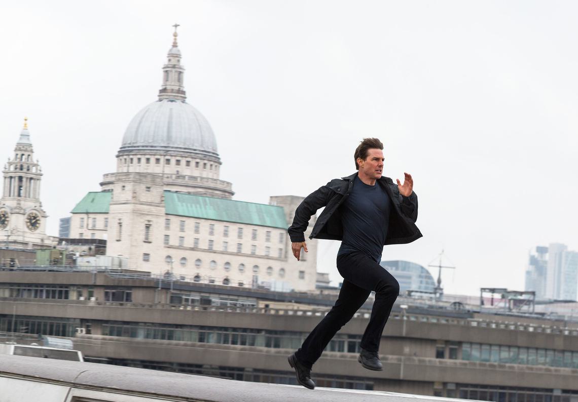 Still from Mission:Impossible - Fallout. Tom Cruise running across a London rooftop with St Paul's Cathedral in the background