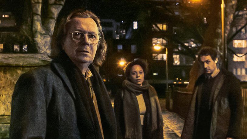Still of Slow Horses, Apple TV+ Three people look beyond the camera