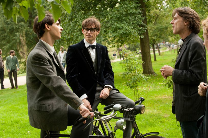 Still of four people on location for The Theory of Everything