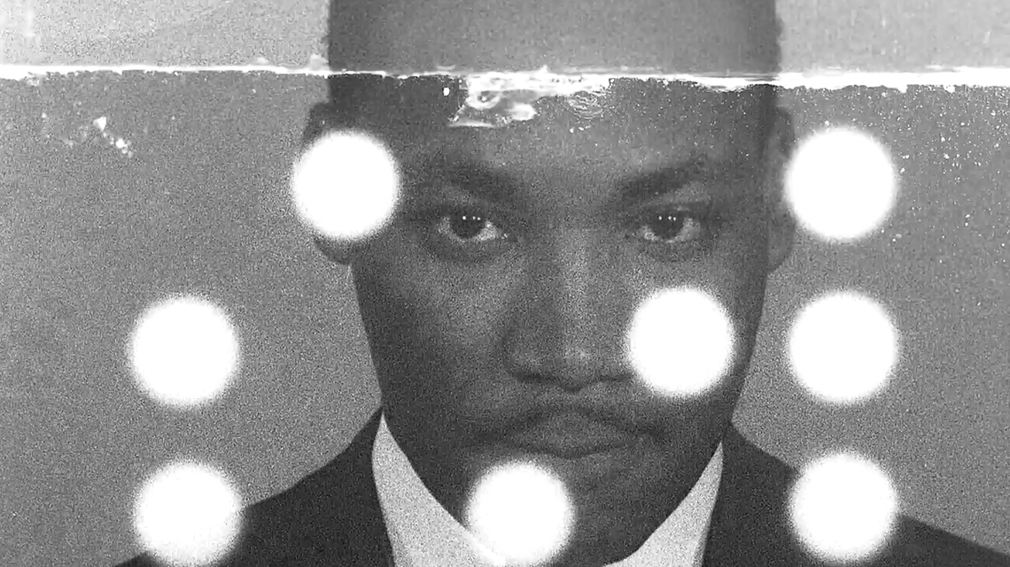 Martin Luther King black and white headshot with white dots on screen