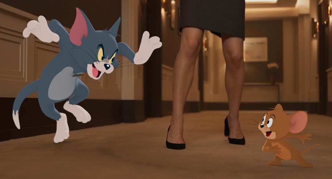 Still of Tom & Jerry: The Movie. Animated cat pouncing on animated mouse
