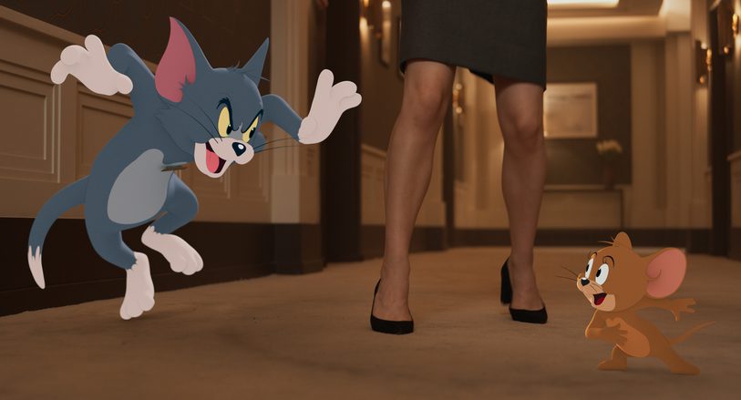 Still of Tom & Jerry: The Movie. Animated cat pouncing on animated mouse