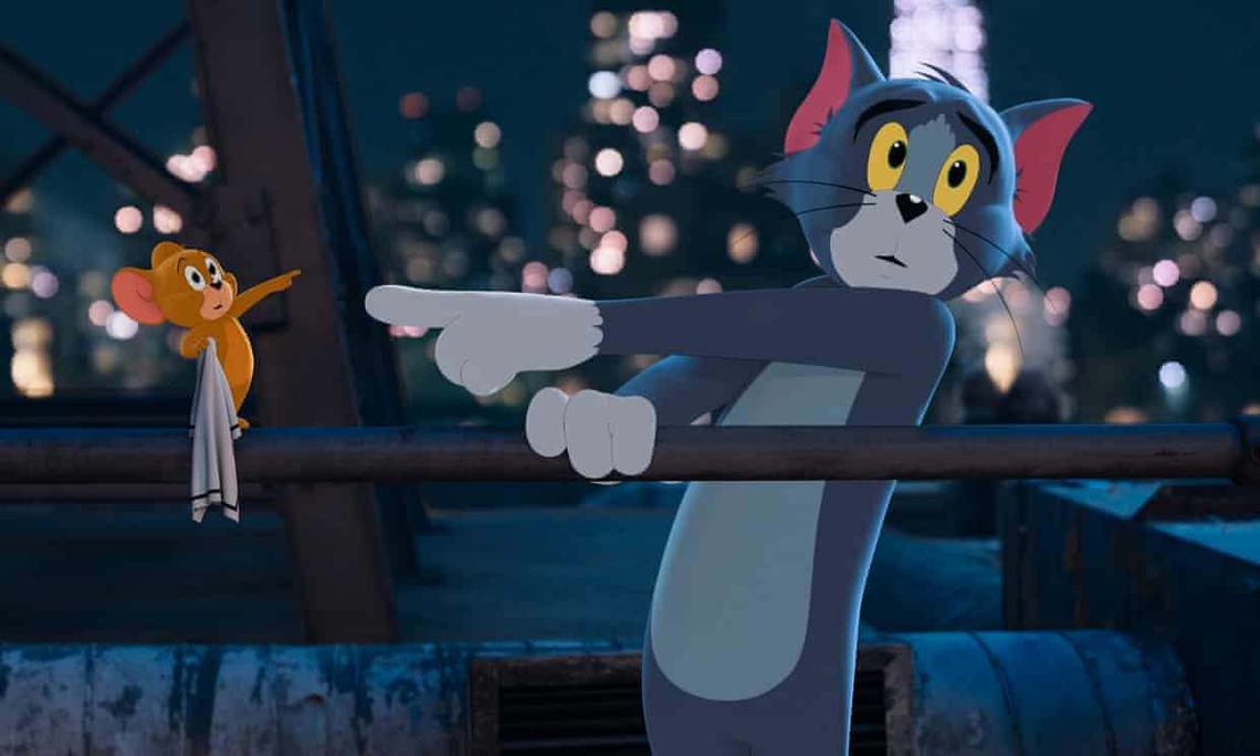 Still of Tom & Jerry: The Movie. Animated mouse and cat pointing at each other