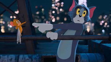 Still of Tom & Jerry: The Movie. Animated mouse and cat pointing at each other