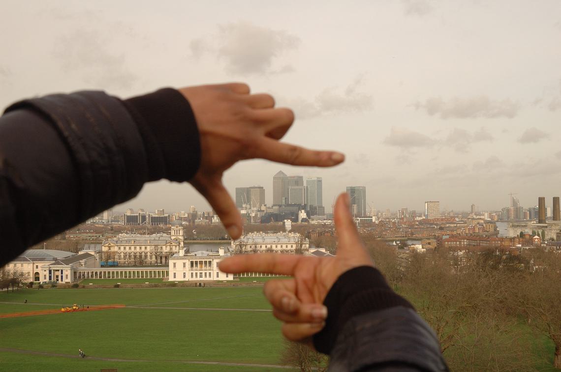 London skyline framed by two hands
